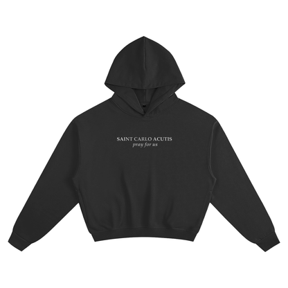 Black hoodie with white text; "Saint Carlo Acutis pray for us". Catholic clothing of saints